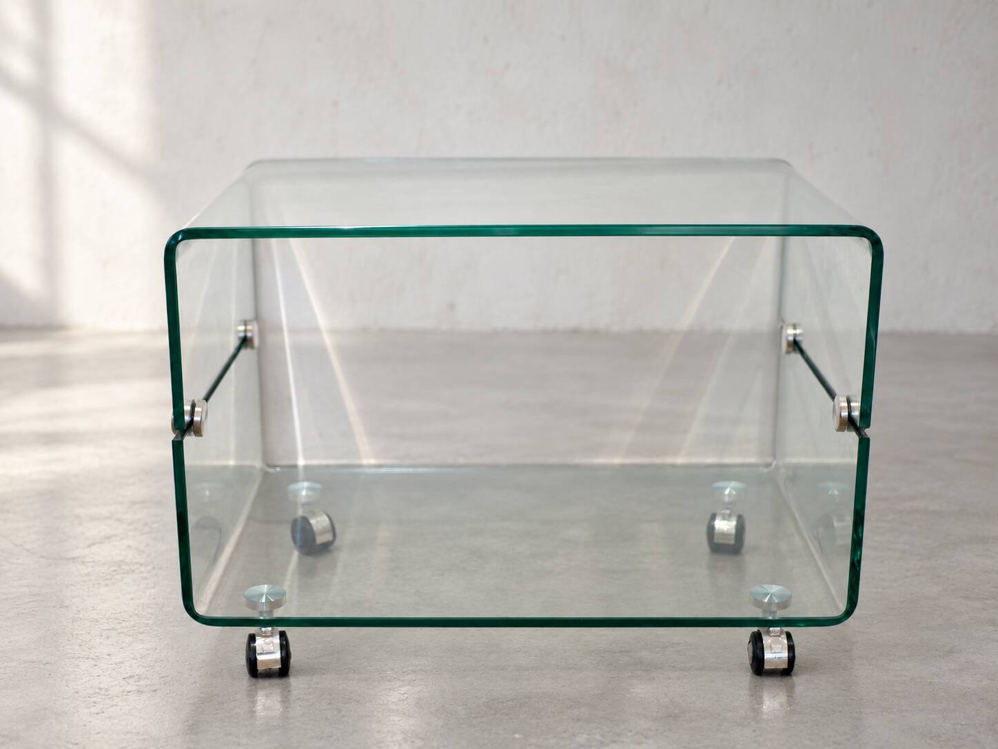 Glass coffee table on wheels