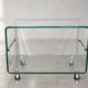 Glass coffee table on wheels