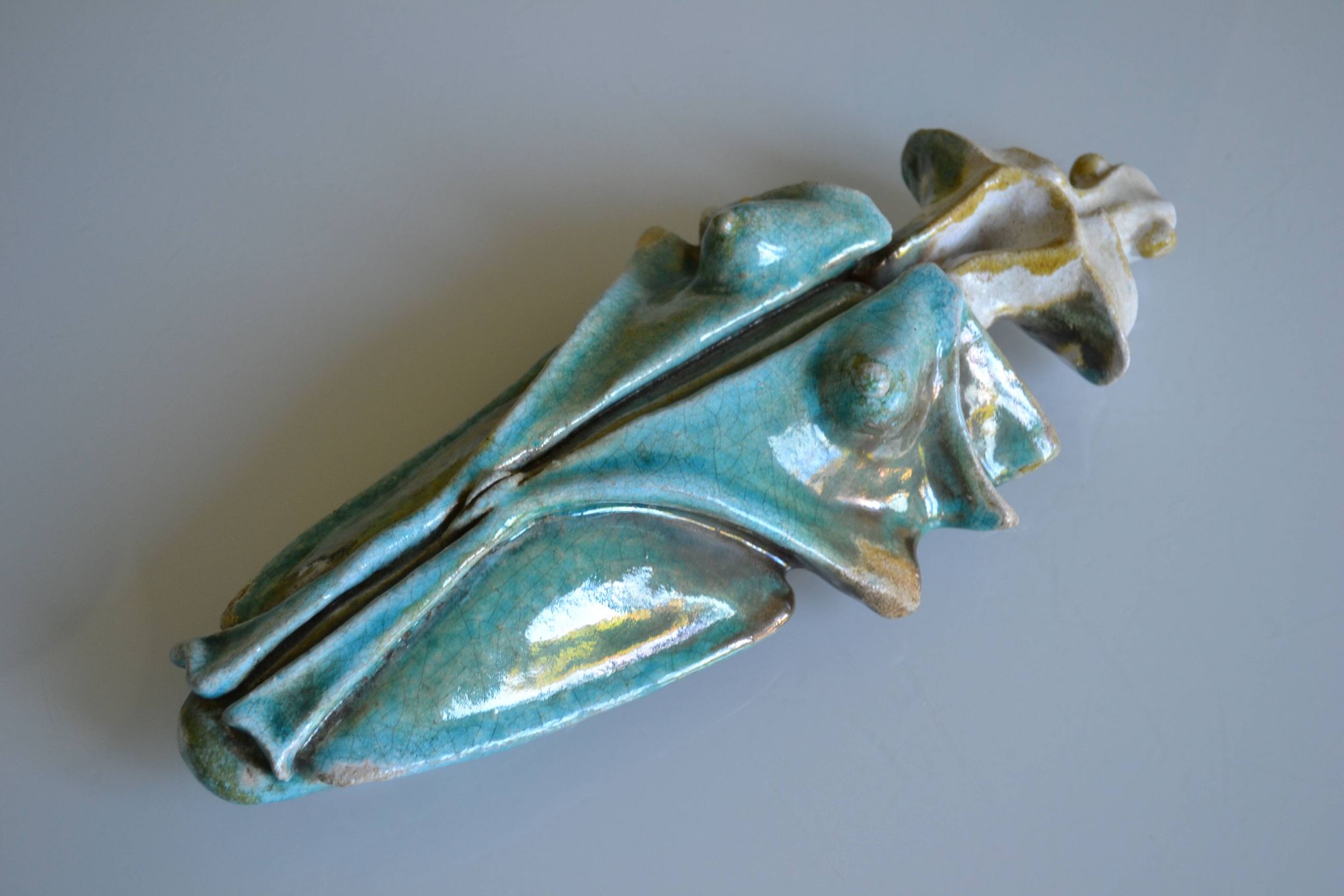 Surreal ceramic sculpture in relief signed to be identified.