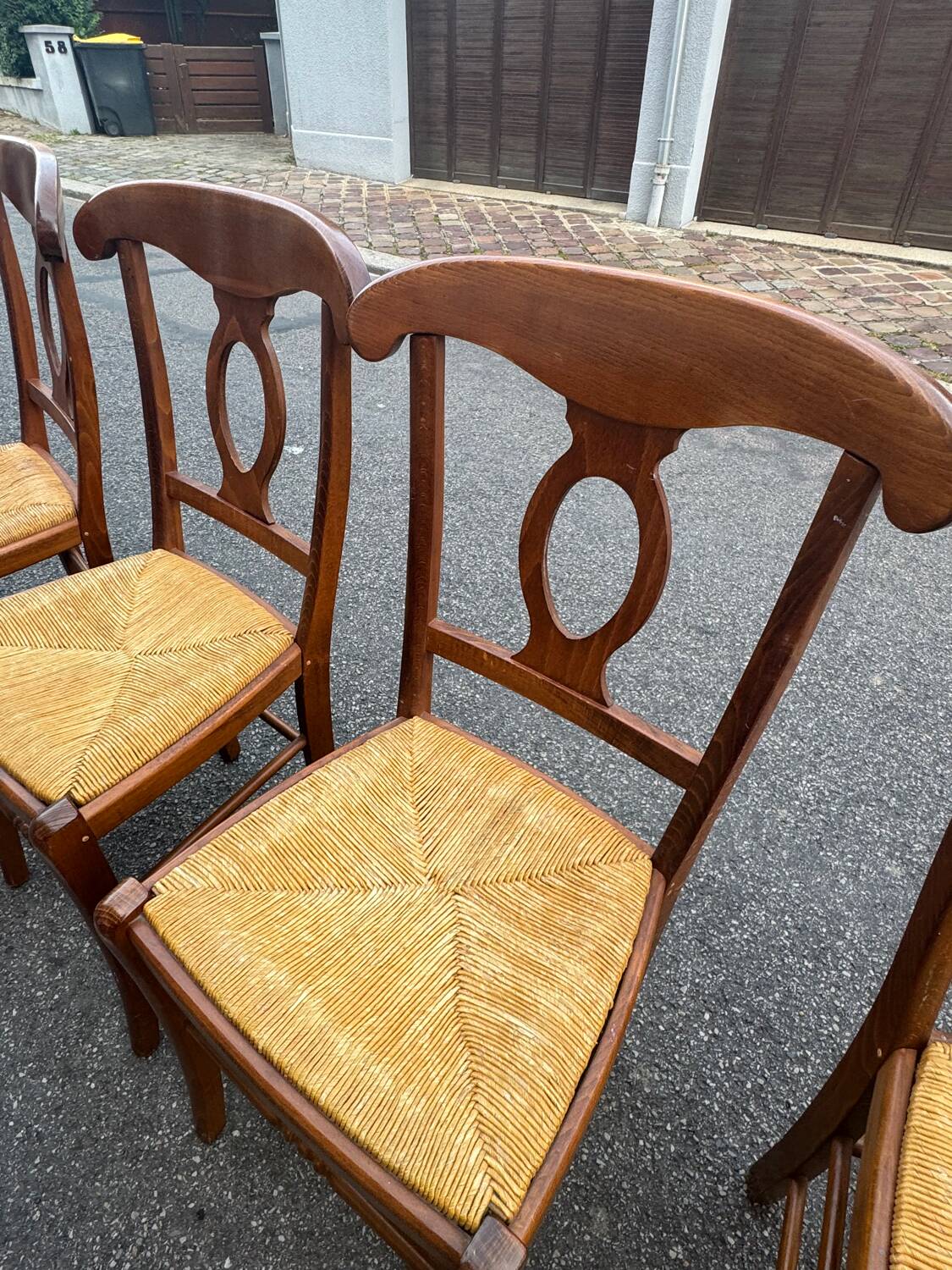 4 straw-seated chairs