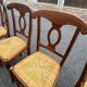 4 straw-seated chairs
