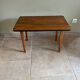 Mid-century coffee table with tapered legs.