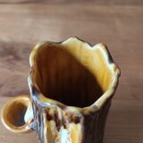 Ceramic vase with tree trunk decoration