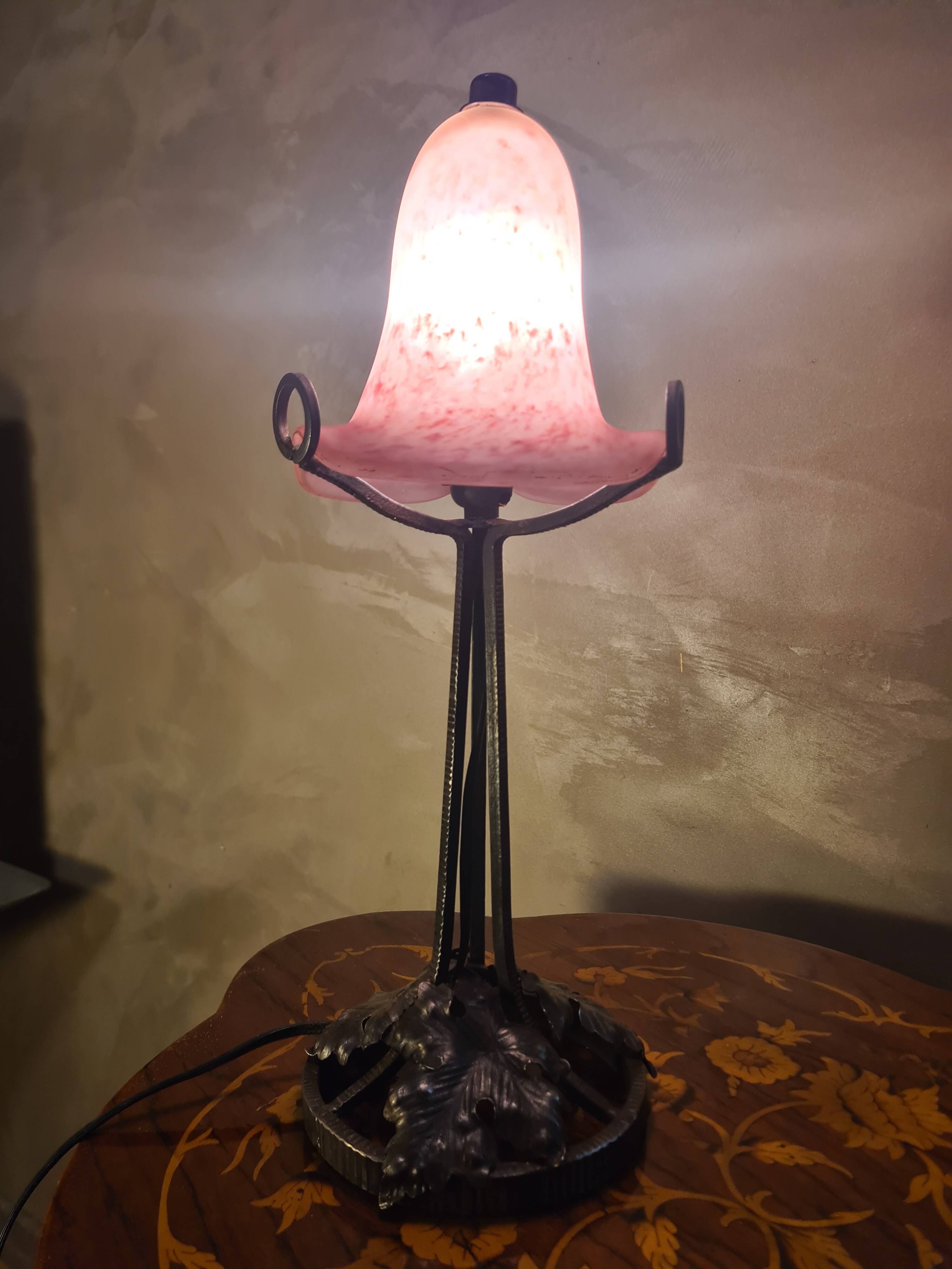 Antique wrought iron floor lamp, 1900, with a glass shade, 40x15.