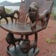 Chair and table of a dignitary in carved wood from Benin, 1950