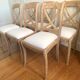 Set of 6 cross-back chairs in solid wood, with white boucle seats.
