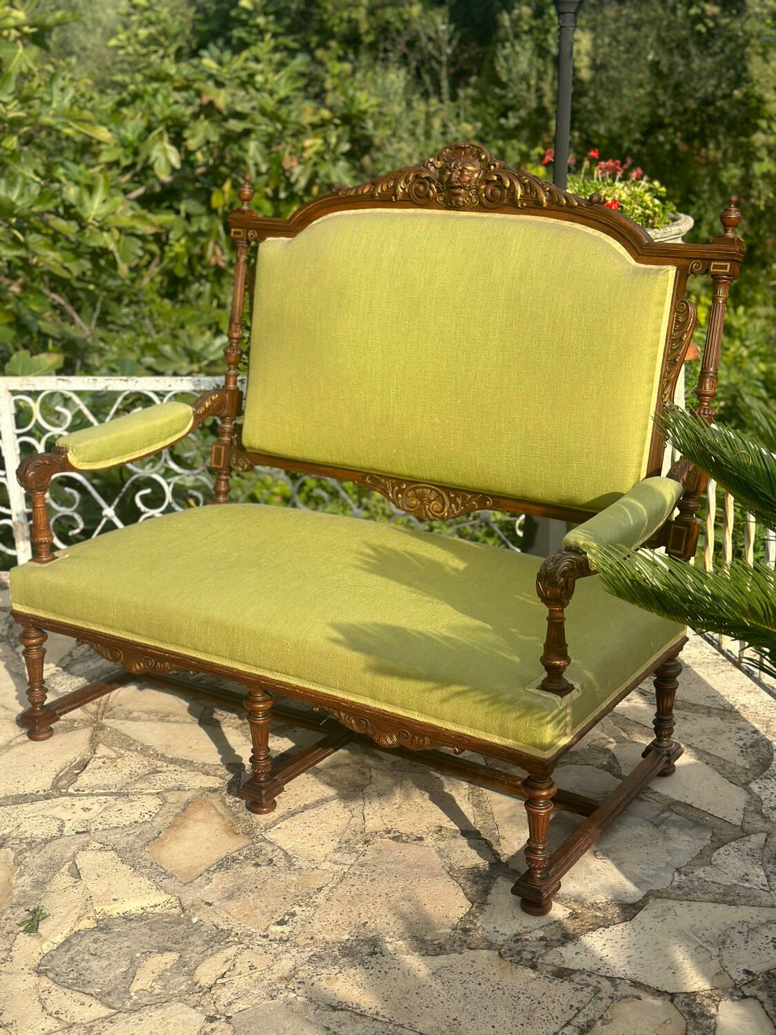 Richly carved solid wood bench in Louis XVI style.