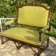 Richly carved solid wood bench in Louis XVI style.