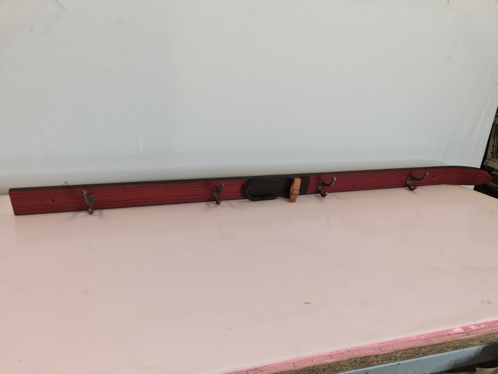 Wooden coat rack and cast iron hooks