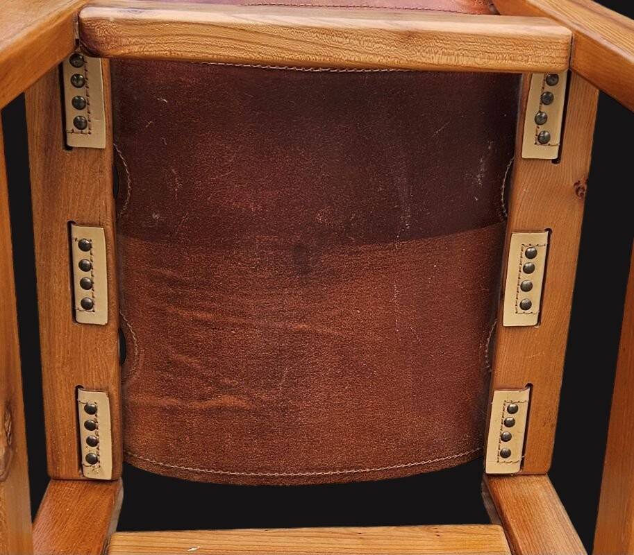 Pair of elm and leather chairs by Maison Regain