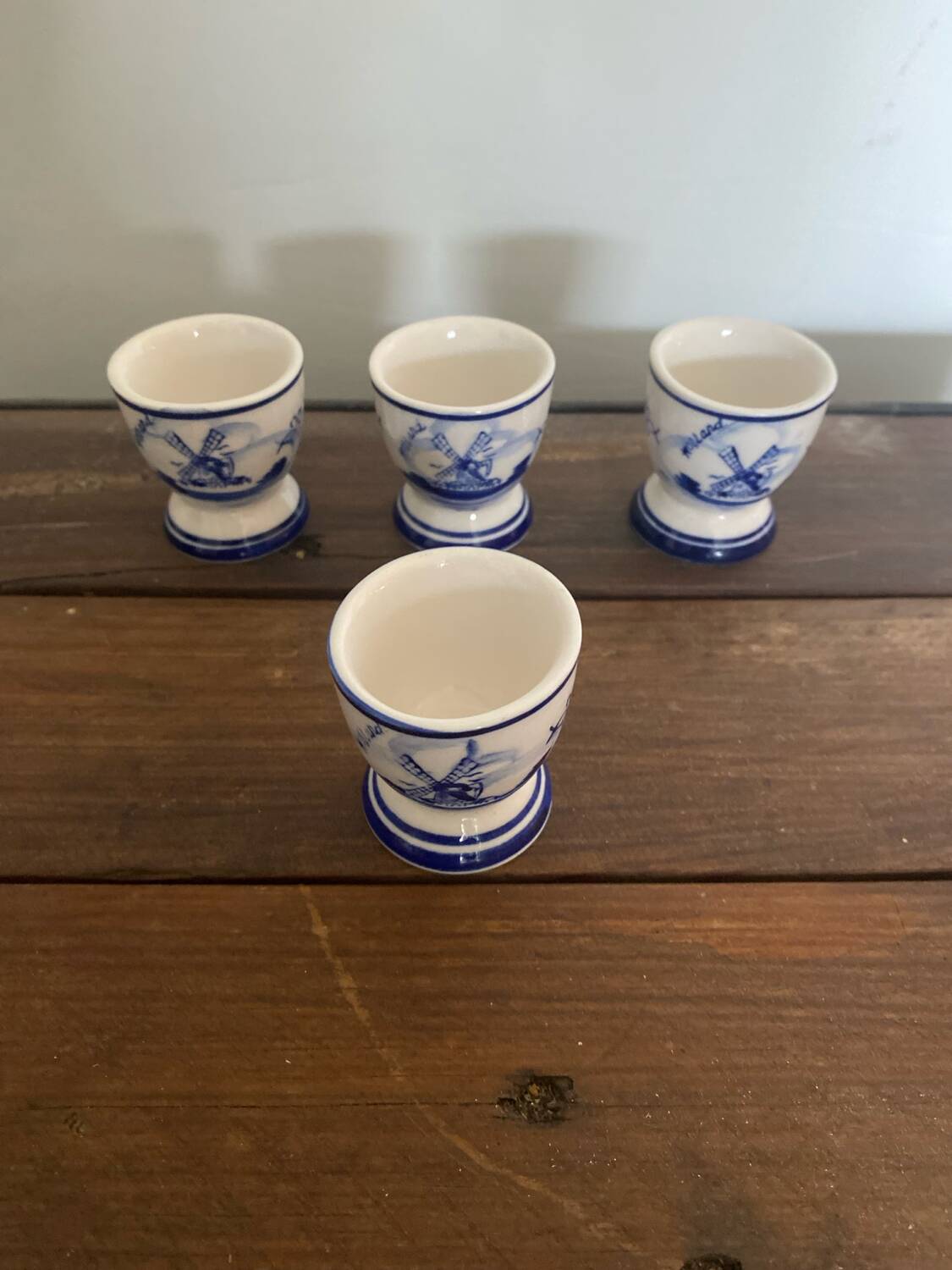Set of 4 antique delft egg cups, white ceramic with blue vinta decor