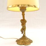 Lampe à poser cherubin en laiton.