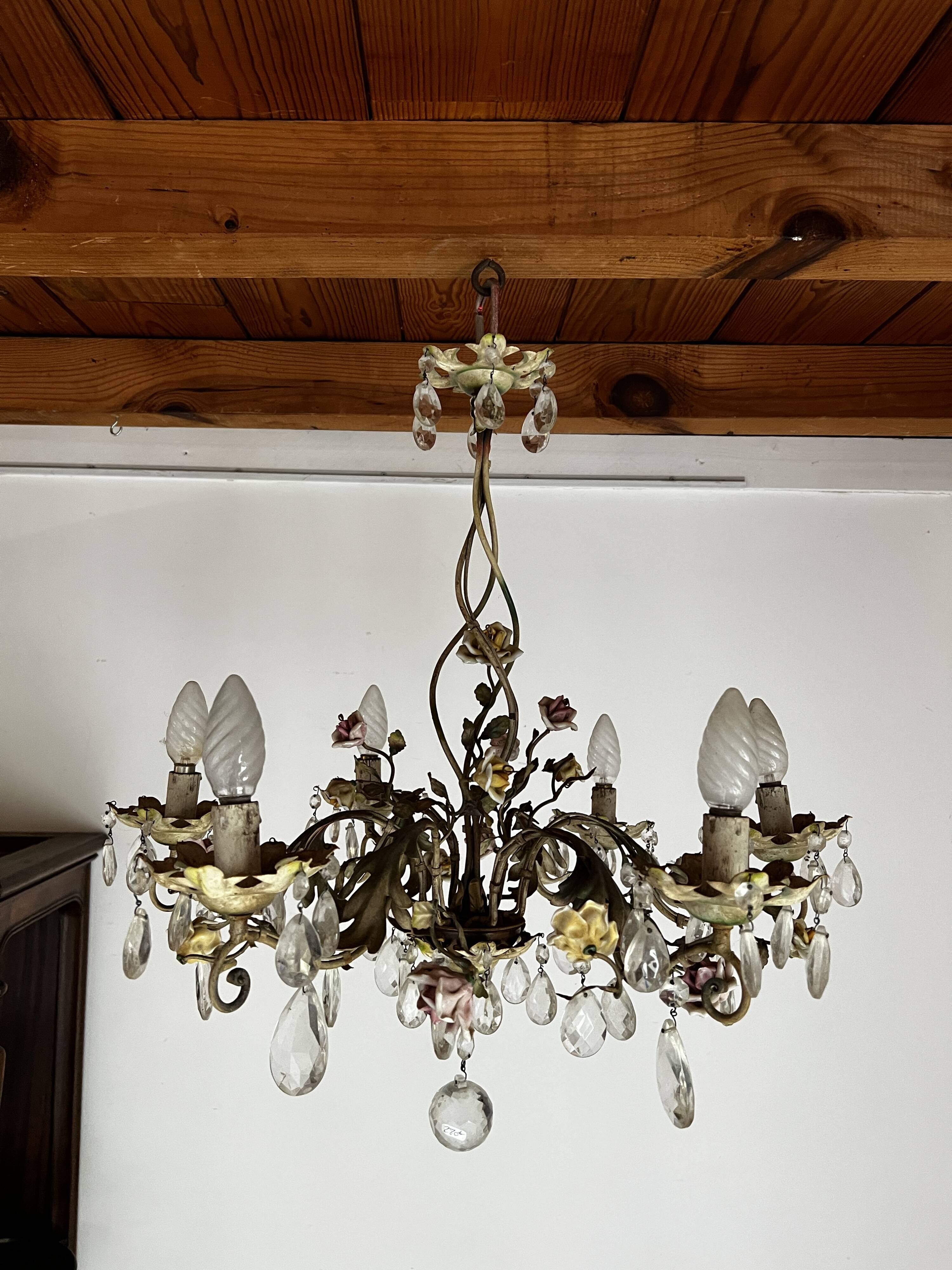 Chandelier with a floral porcelain decoration and pendants
