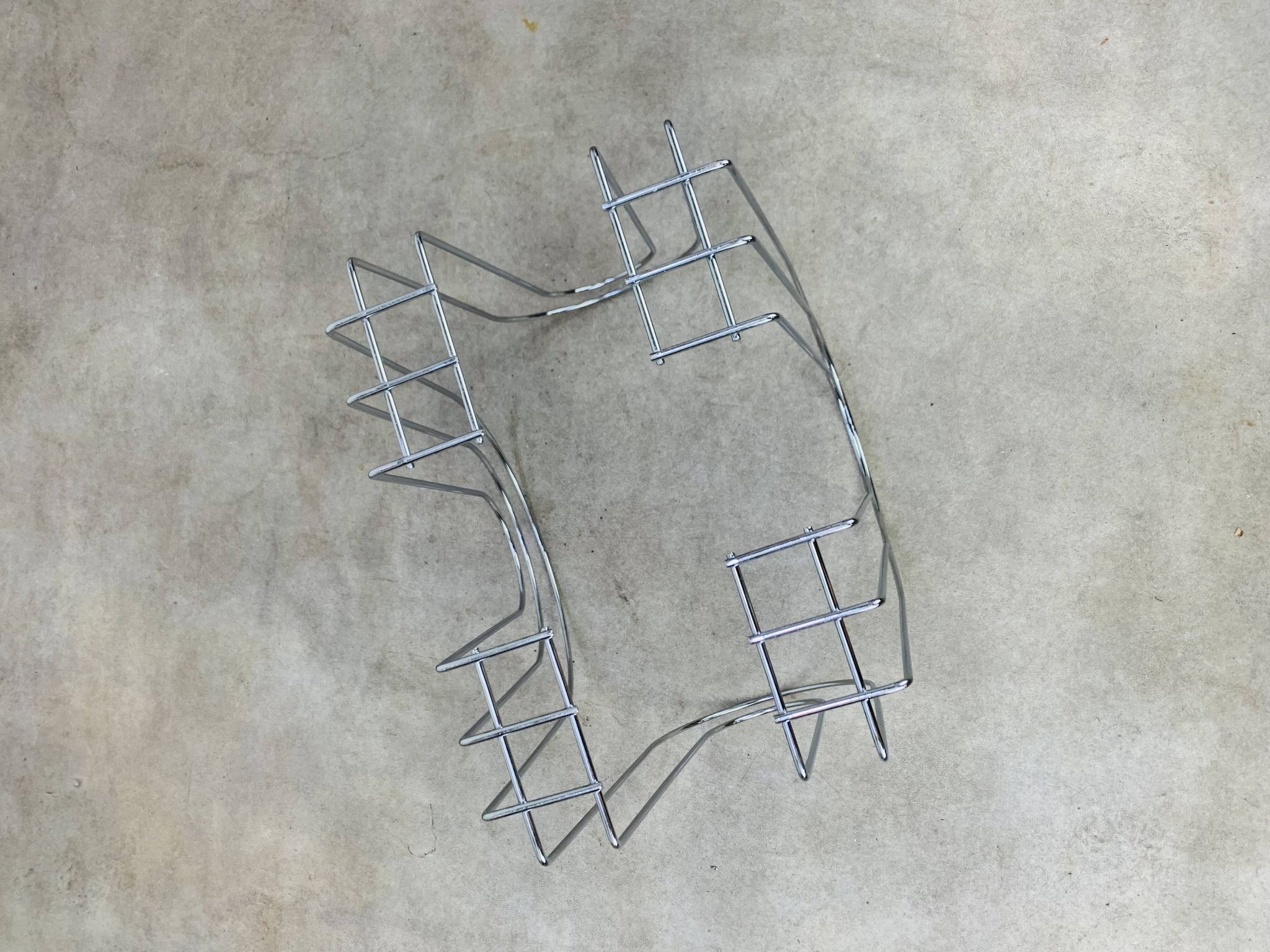 Postmodern chrome metal magazine rack from the 80s