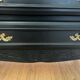 Louis XV style black and gold commode