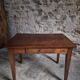 Old French table in cherry wood with bistro chair, circa 1900–1930.