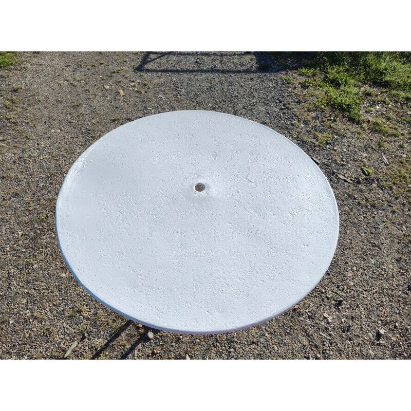 Garden table with a cast iron base and a metal top.