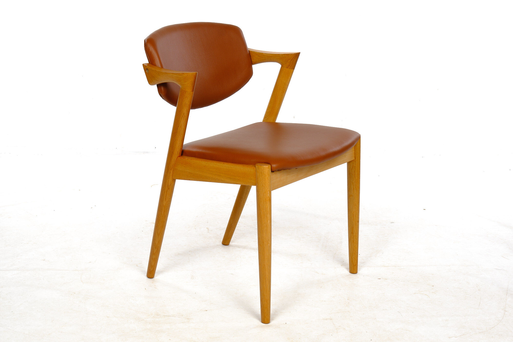 Four Kai Kristiansen oak chairs with new leather upholstery