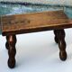 Footstool in varnished wood turns old