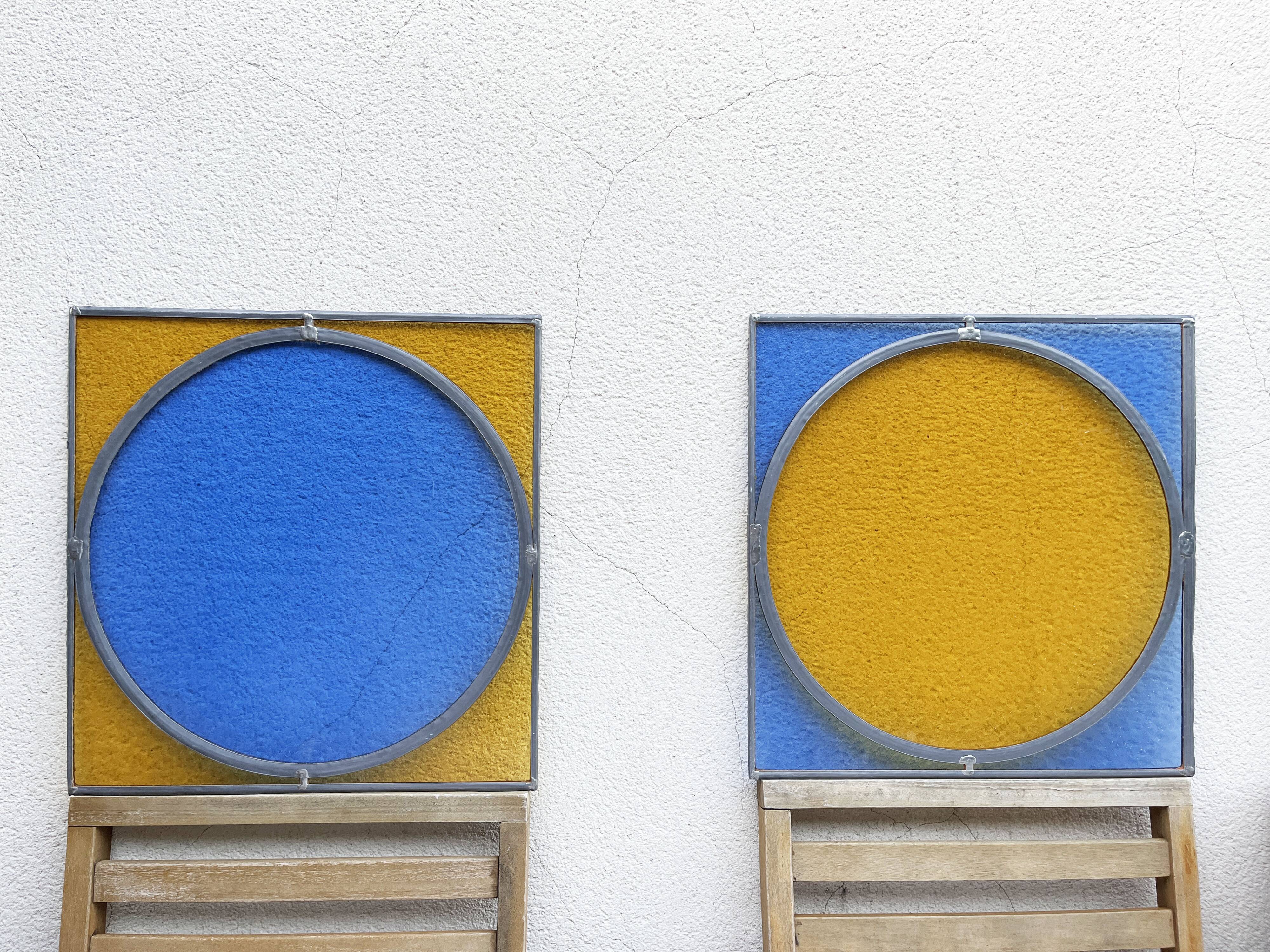 Pair of antique blue and yellow stained glass windows