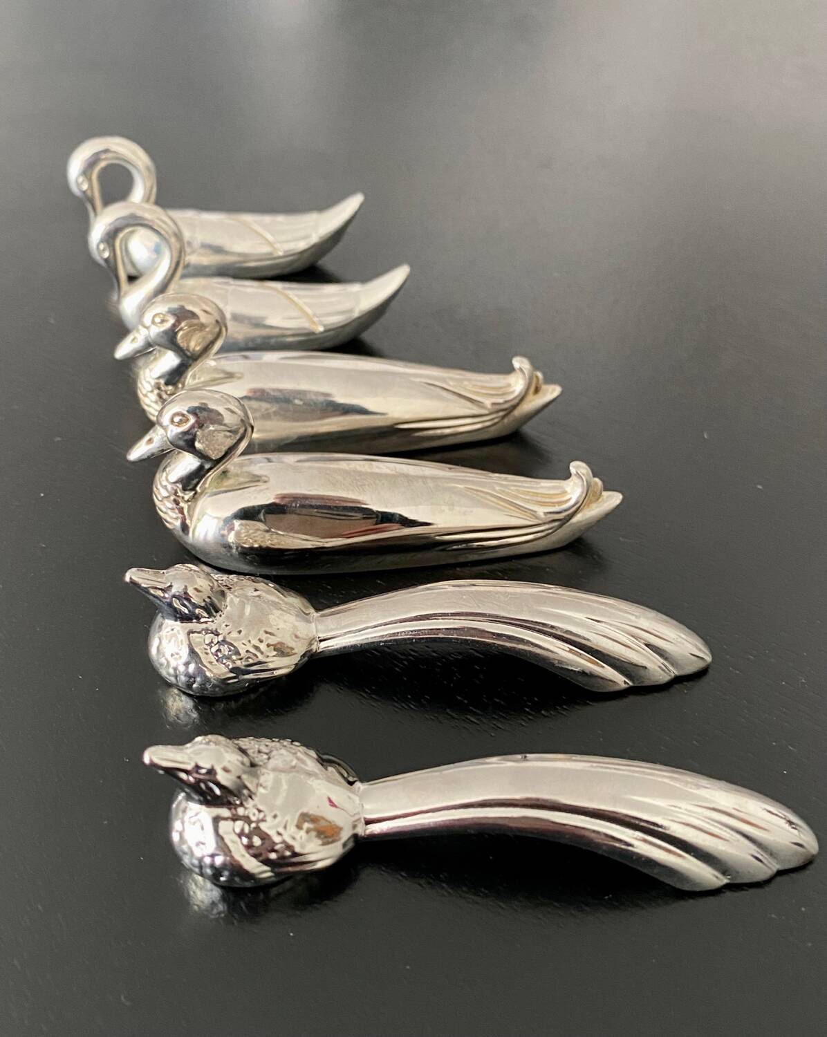 6 various animal shaped knife holders in silver metal
