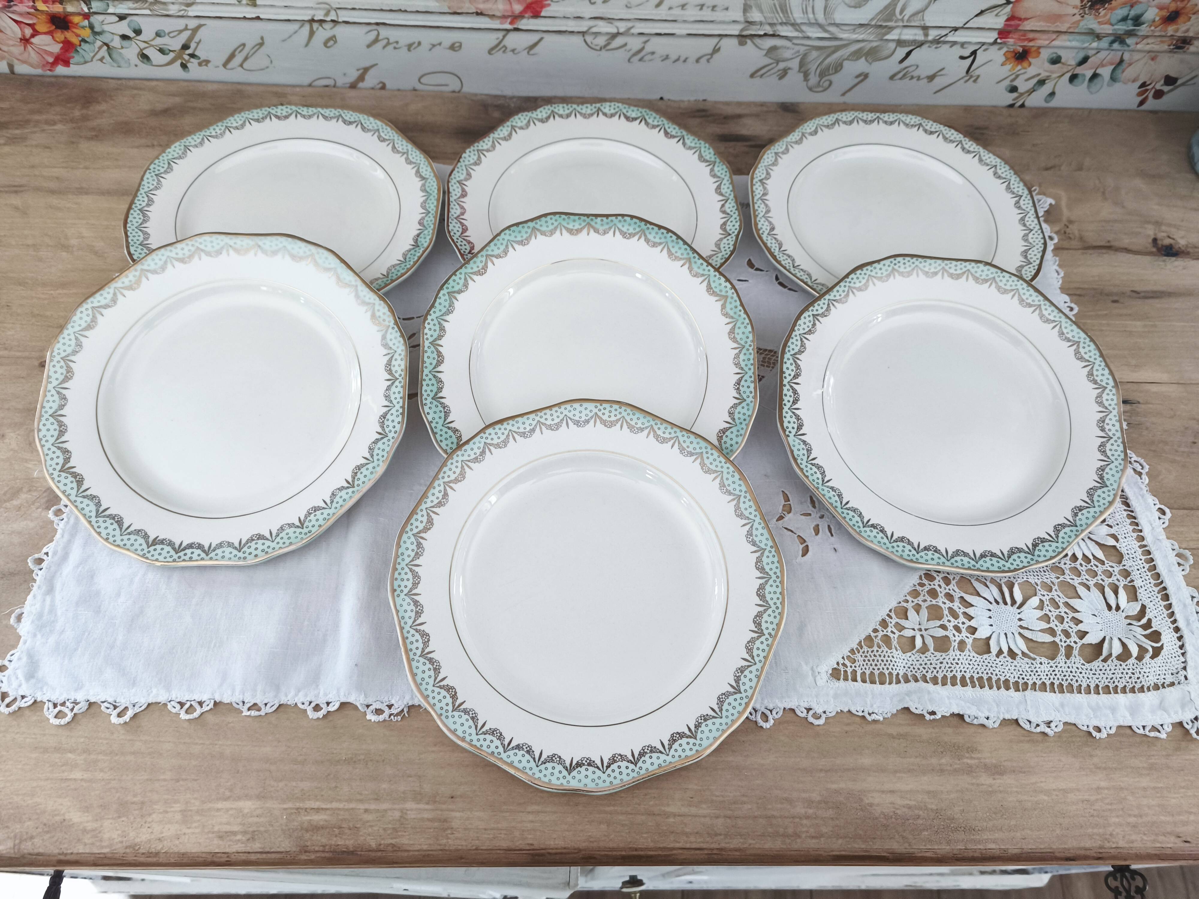 Set of 7 Longwy France earthenware dessert plates, Trianon model