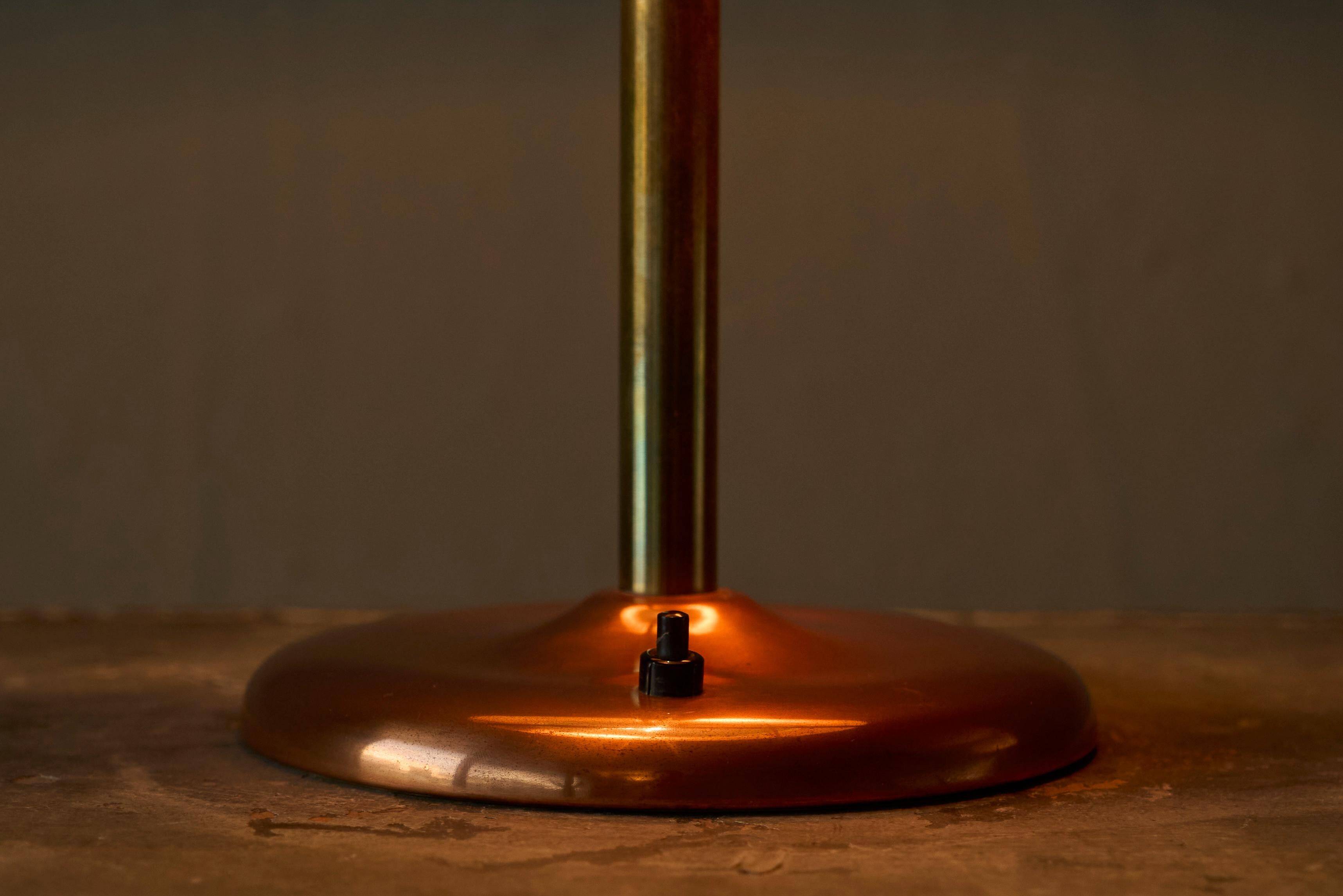 Art Deco table lamp in patinated copper, brass, and satin glass from the 1950s.