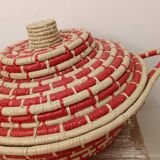 Red and beige woven basket with lid