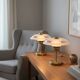 Pair of Art Deco bedside lamps in brass and engraved glass.