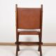 Pair of brutalist style chairs, in wood and leather.