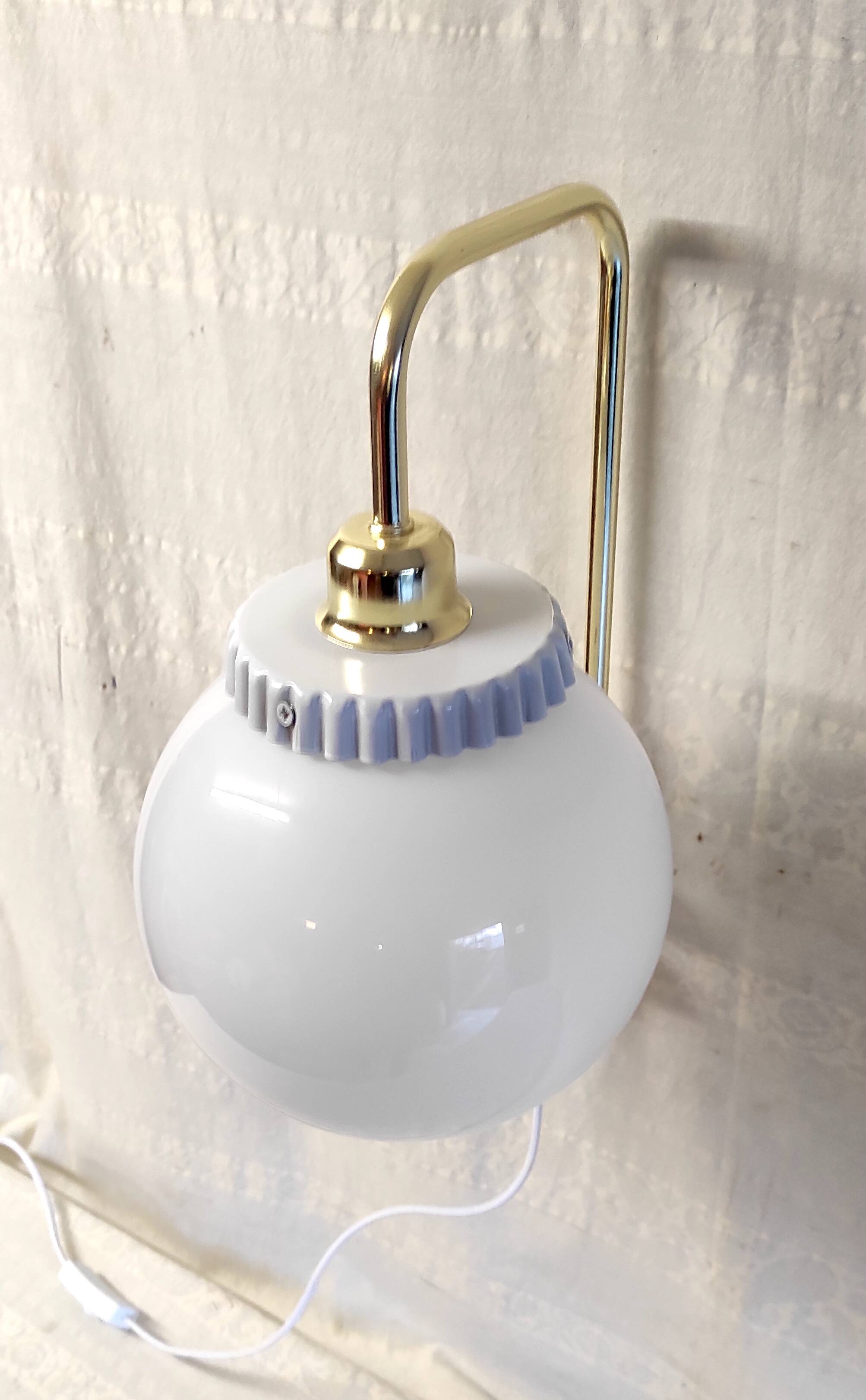 Opaline glass globe wall sconce with a gilt metal bracket - mid-20th century