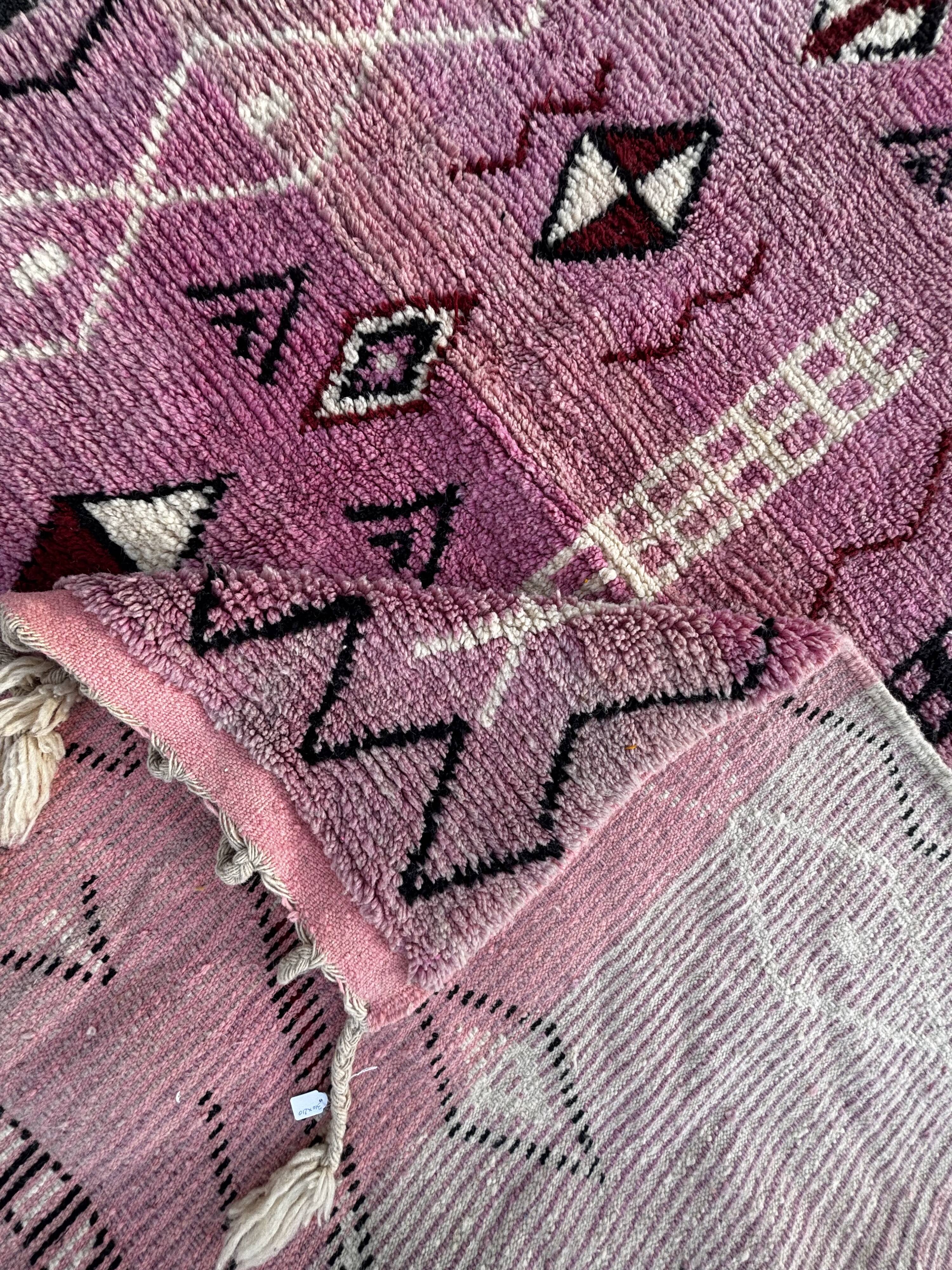 Berber Moroccan pink carpet made of wool in Morocco.