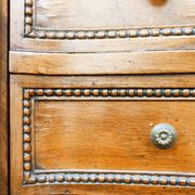 Pair of bow-fronted chests of drawers in walnut