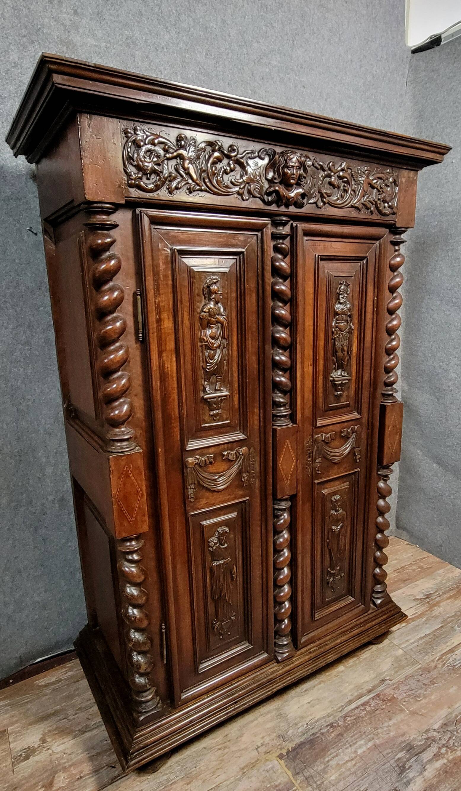 Renaissance style wardrobe in richly carved solid wood, 17th century