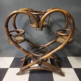 Authentic vintage wicker rattan plant stand planter.