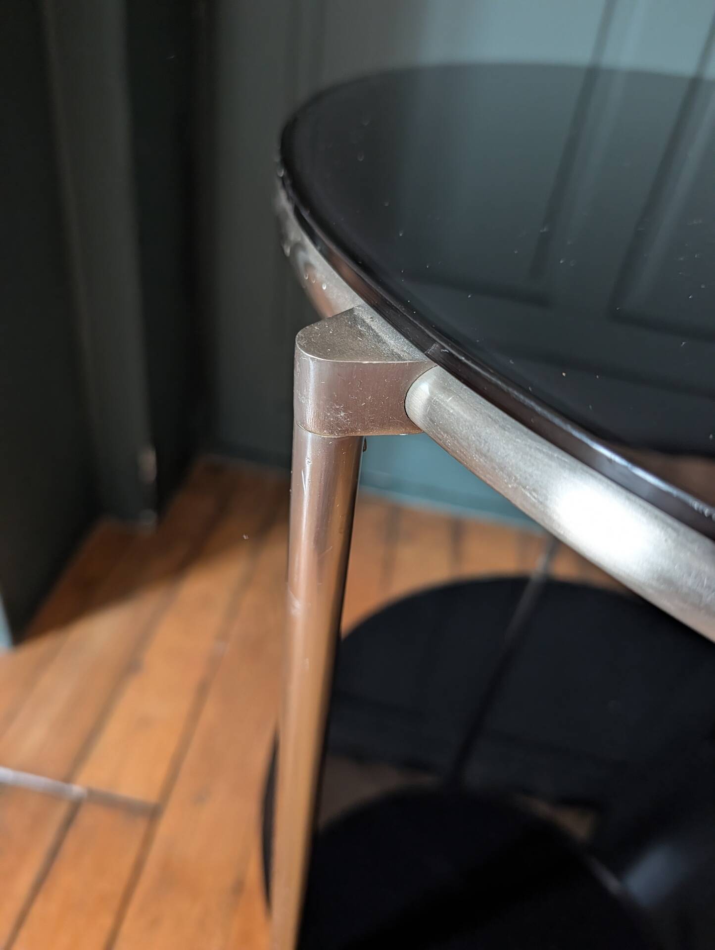 Vintage side table on wheels – black glass top