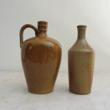 Set of two enamelled stoneware bottles.