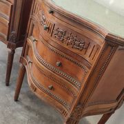Pair of bow-fronted chests of drawers in walnut