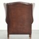 Comfortable cowhide wingback armchair in English style with a timeless look