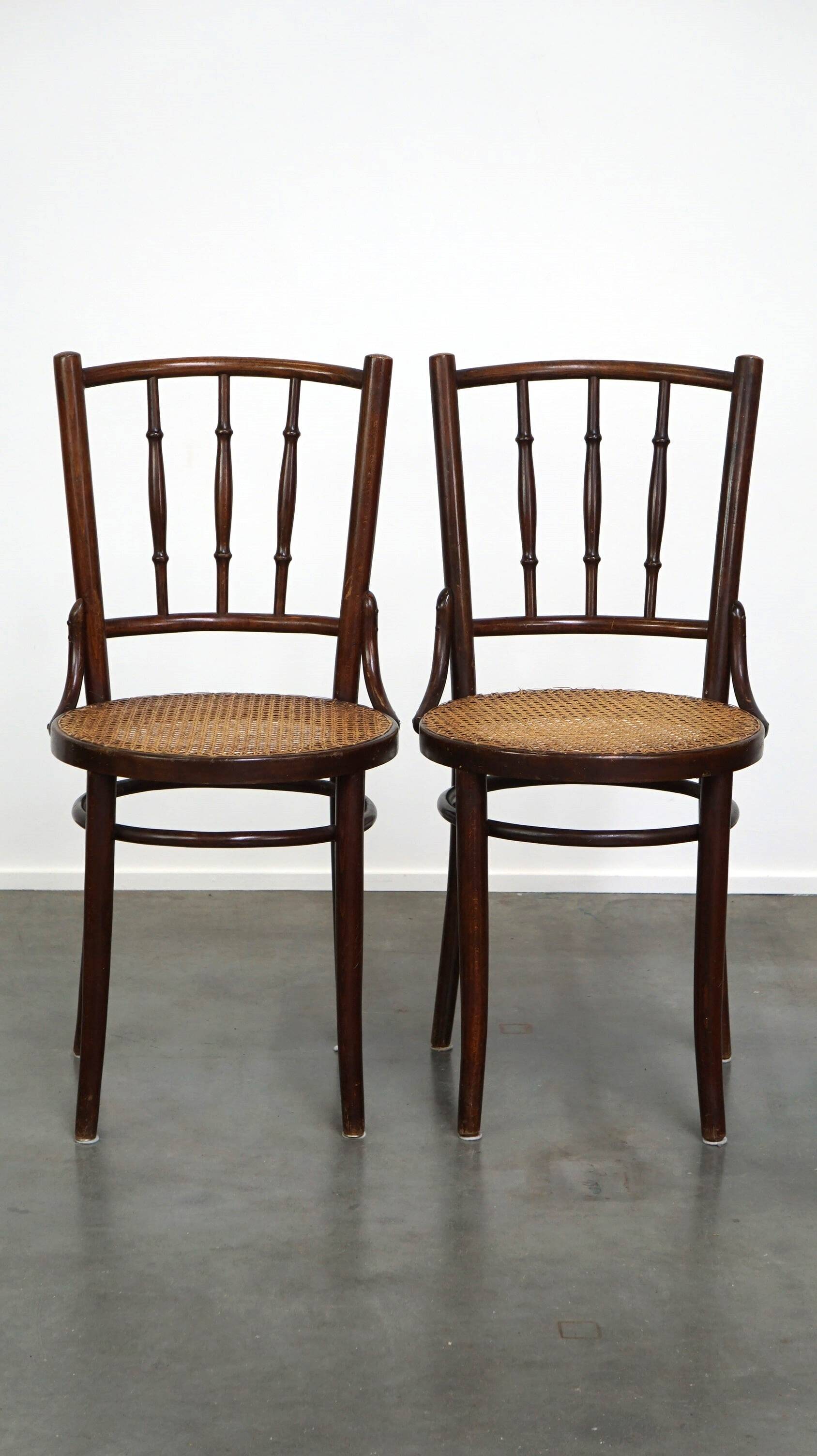 4 antique wooden and cane bistro chairs