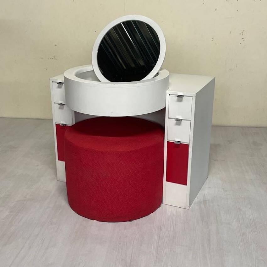 Bathroom toilet with a 70s pouf.