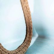 Vintage 70s bohemian wall mirror in woven rattan.