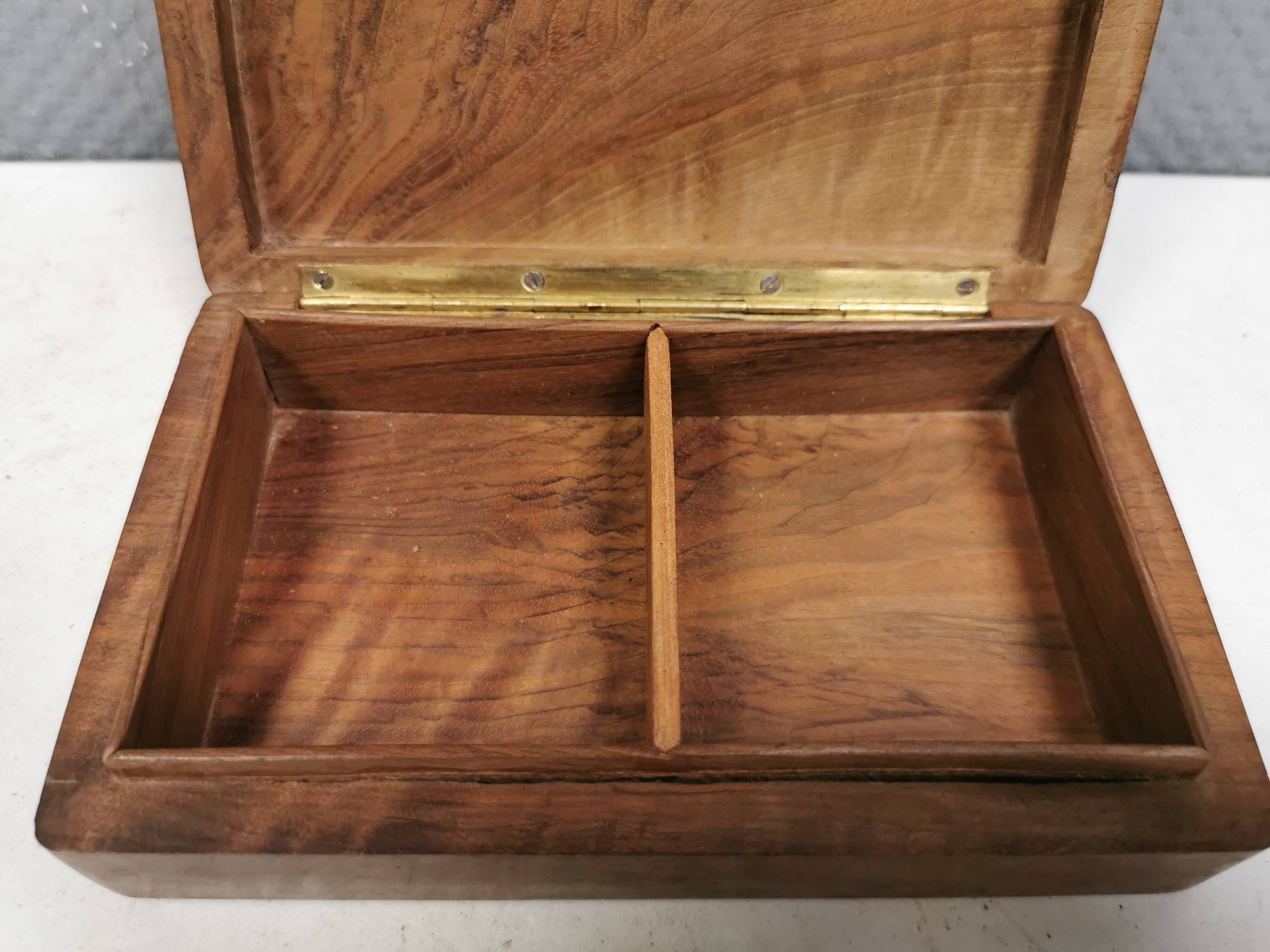 Wooden trinket box for storing jewellery, cigarettes or similar items.