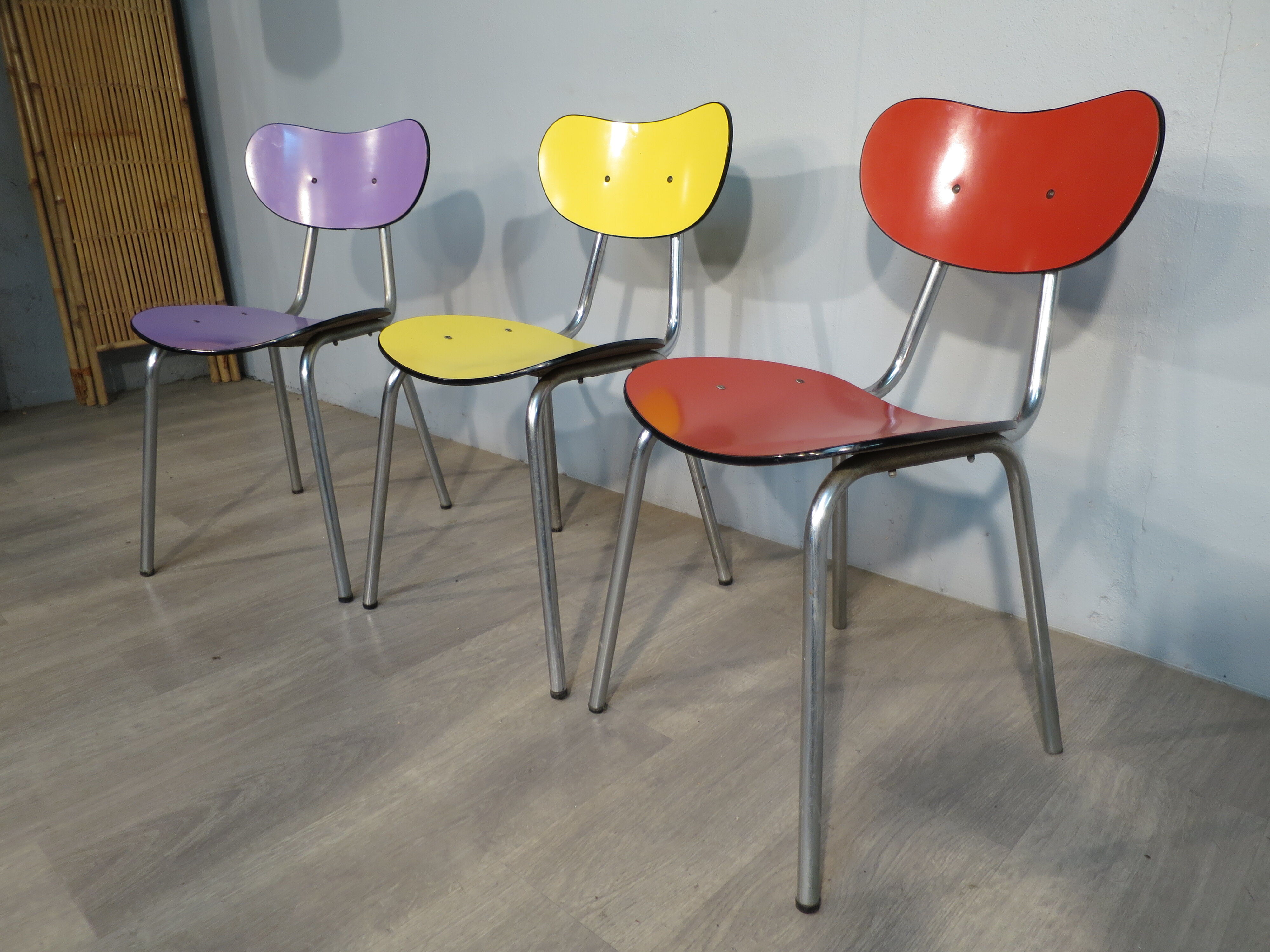 3 colored formica chairs