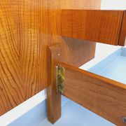 Double bed vintage modernist in teak and black metal from the 1960s with bedside tables.