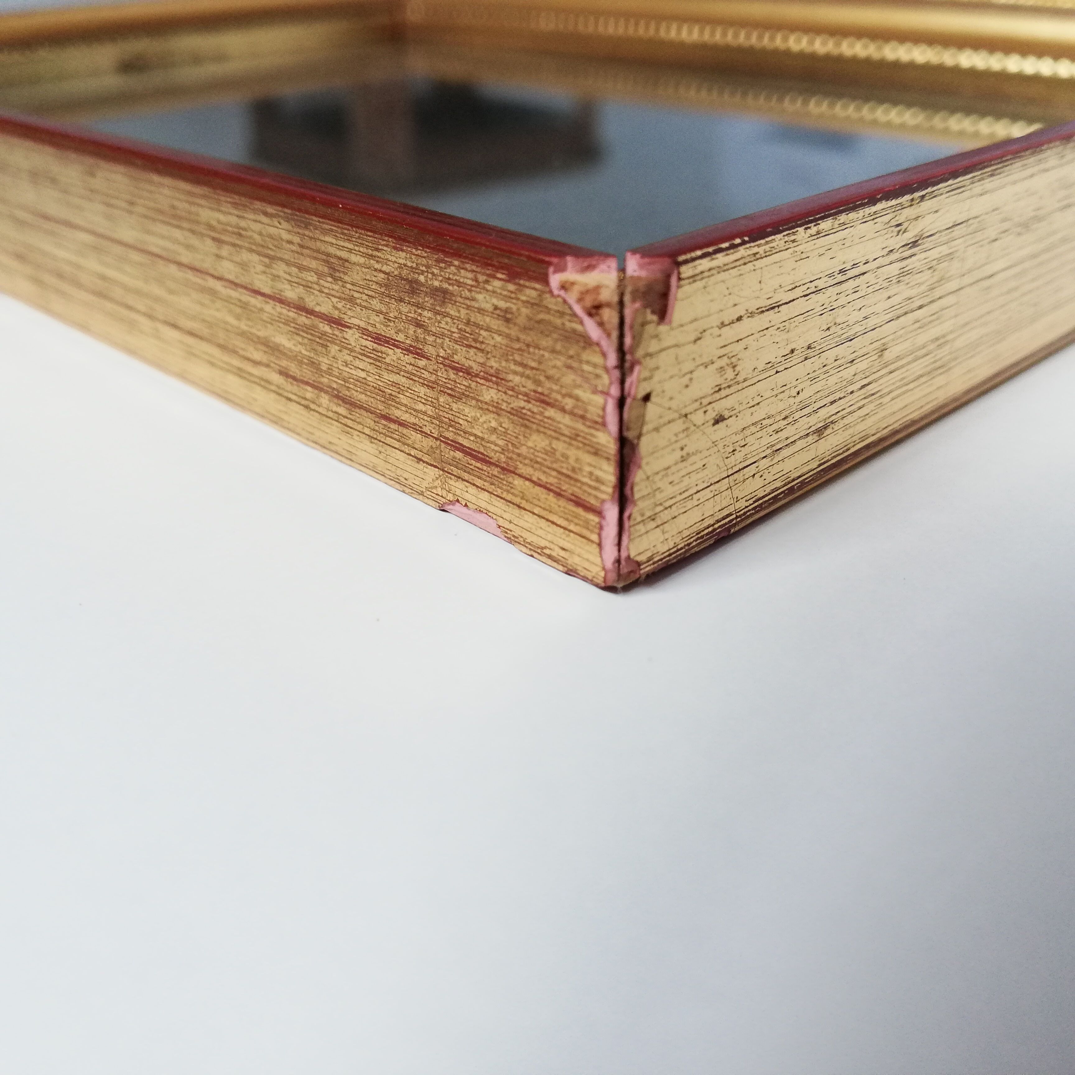 Pair of photo frames under glass, gilded wood