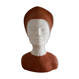 Bust of a woman in plaster terracotta and white color
