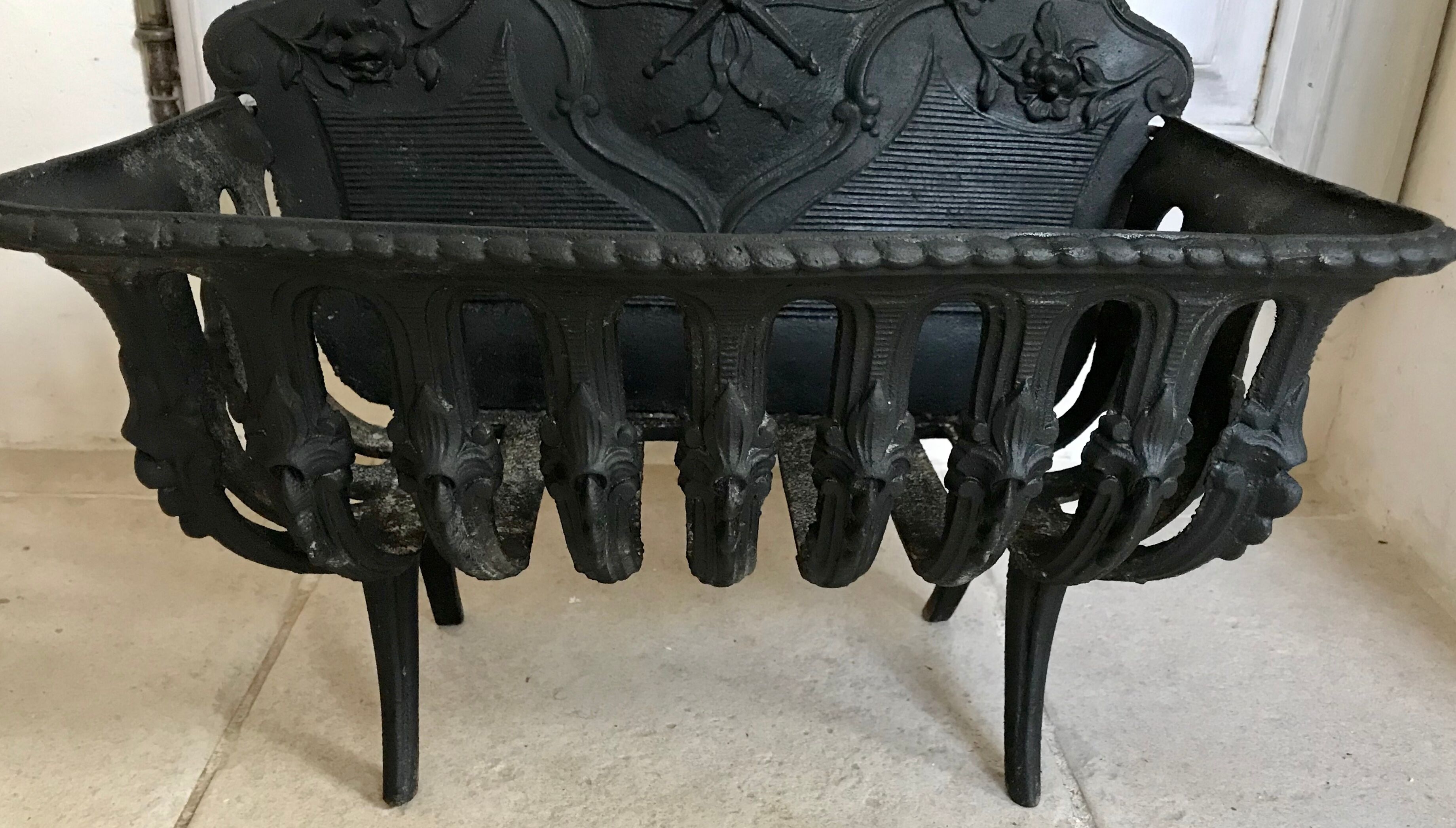 Cast iron fireplace cradle log holder