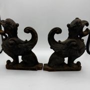 Pair of winged chimera and dragon fire dogs in cast iron