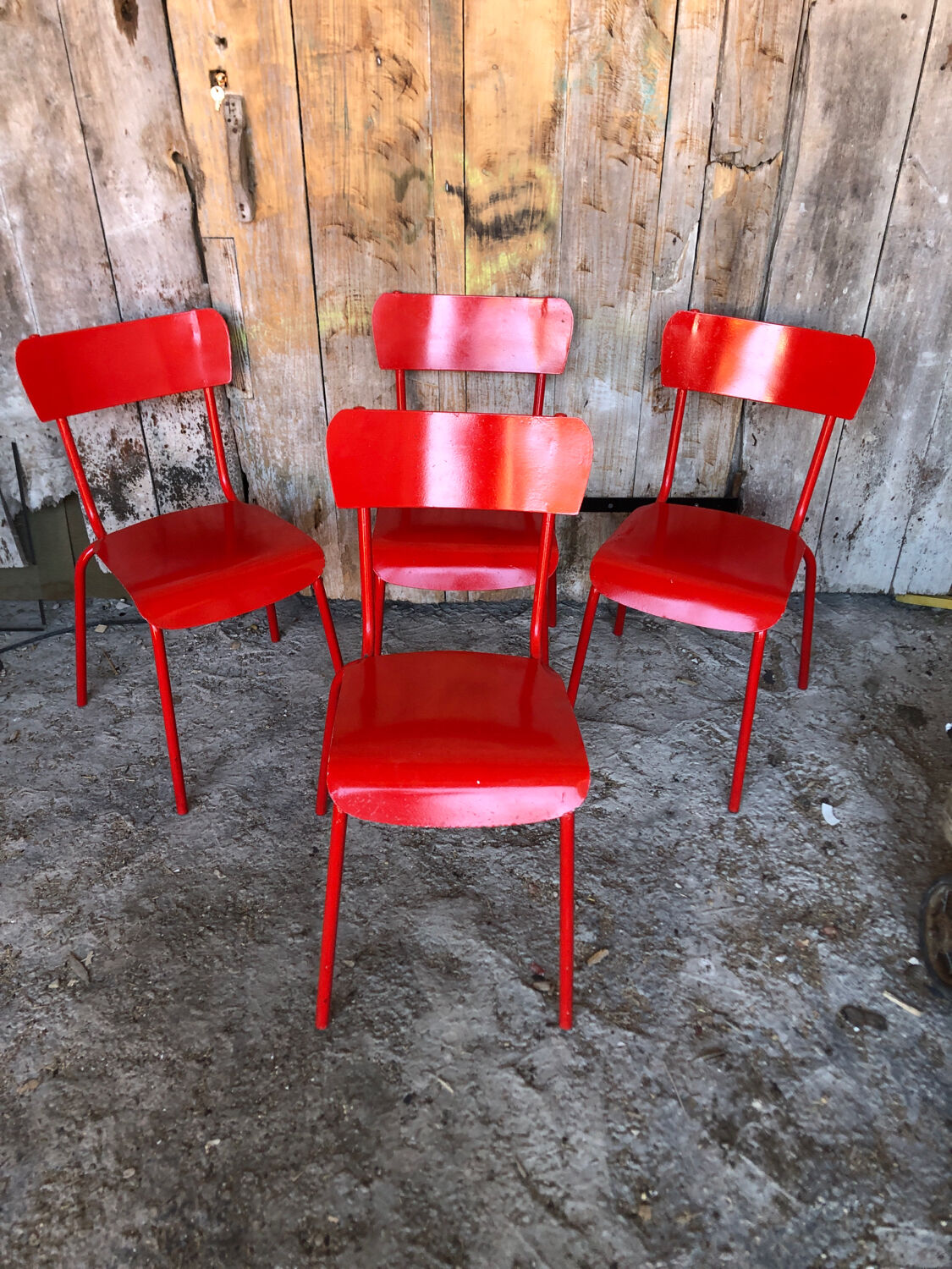 Set of 4 red metal chairs